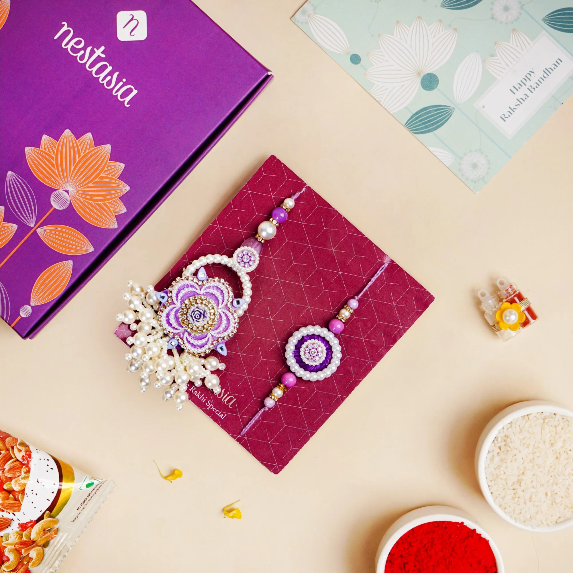 Purple Pearl Beaded Rakhi With Floral Lumba For Couples - Image 2