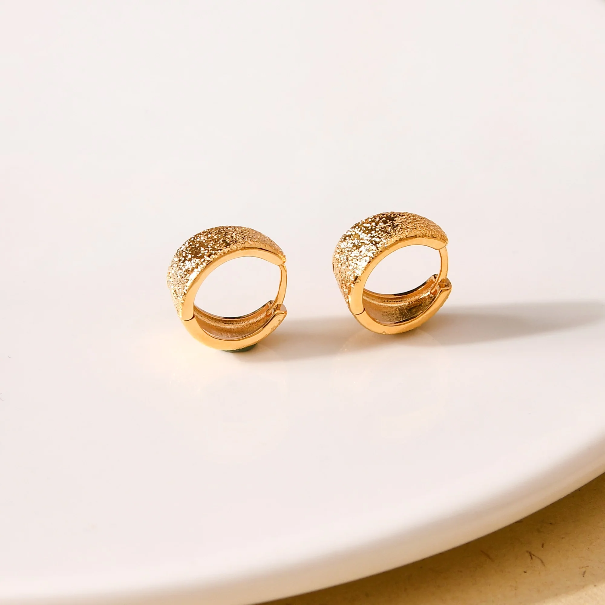 Sleek Textured Gold Hoop Earrings - Image 2