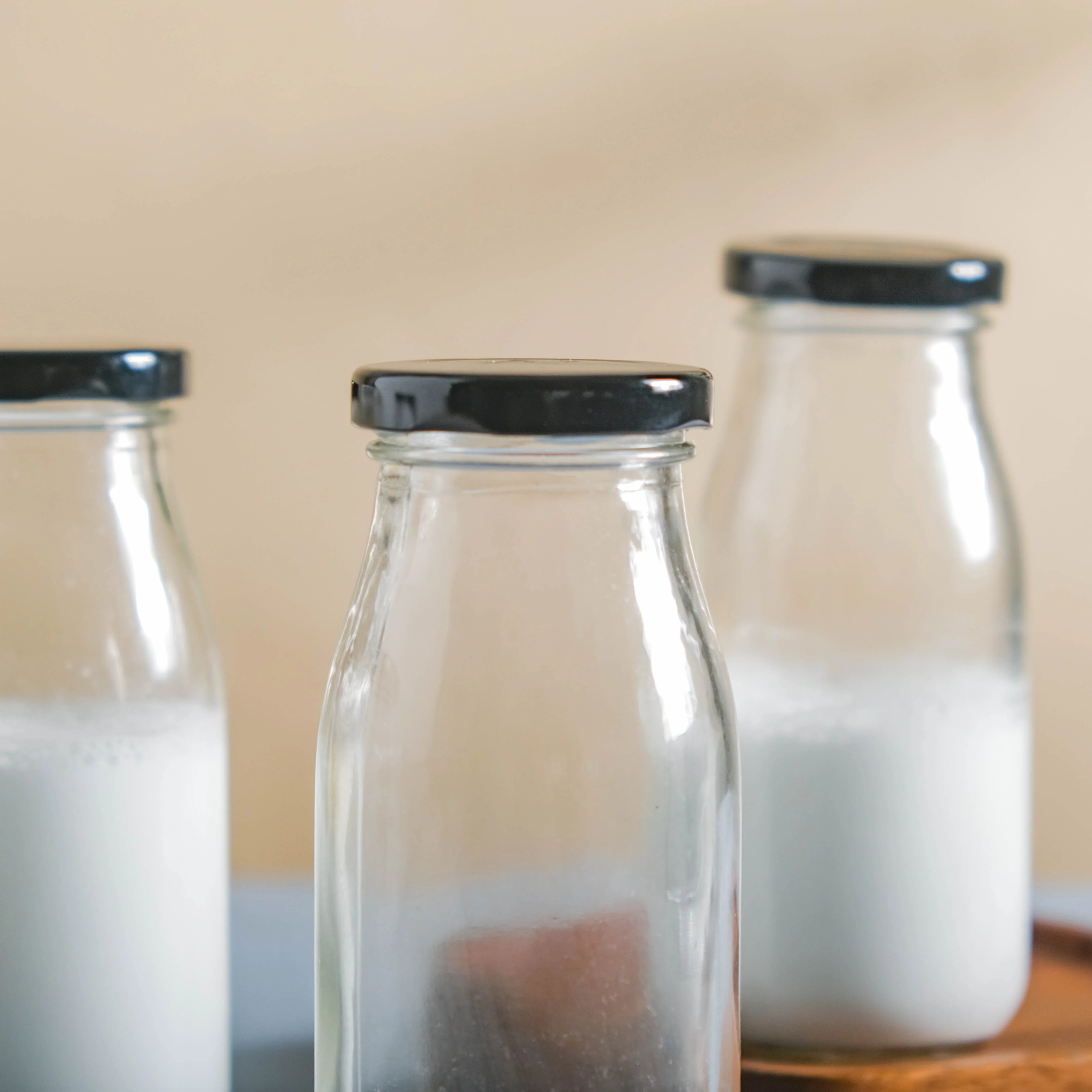 Small Glass Bottle with Lid Set of 4 - Image 5